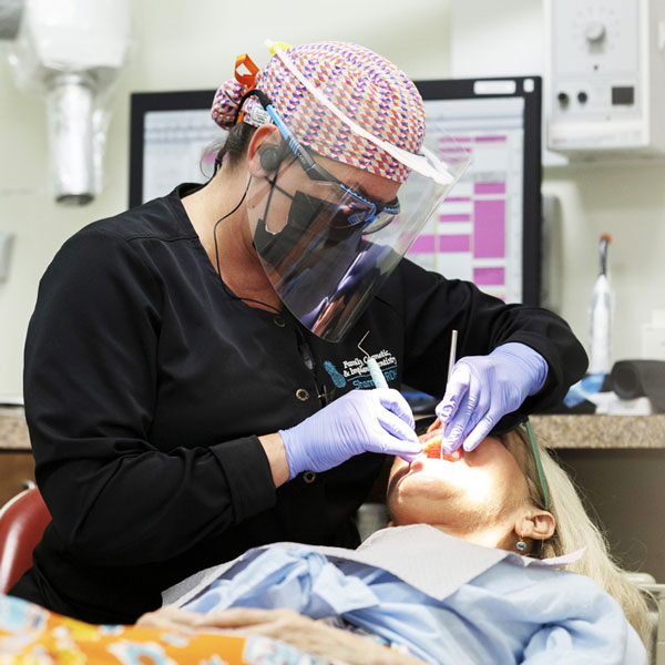 staff member examining patient