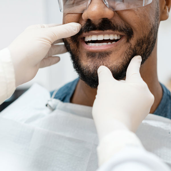 dentist examining man's mouth