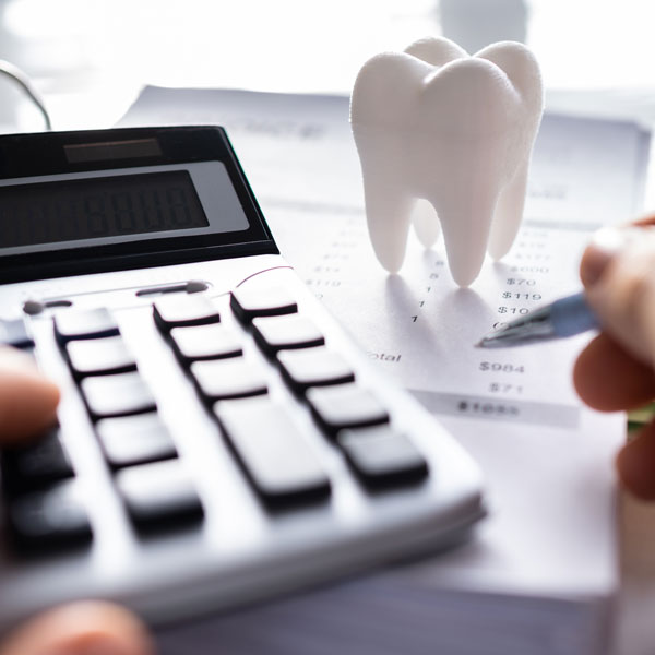 calculator and tooth on financial document