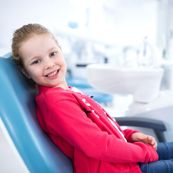 young girl in dental chair