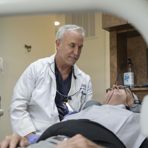 Dr. Beal with patient in dental chair